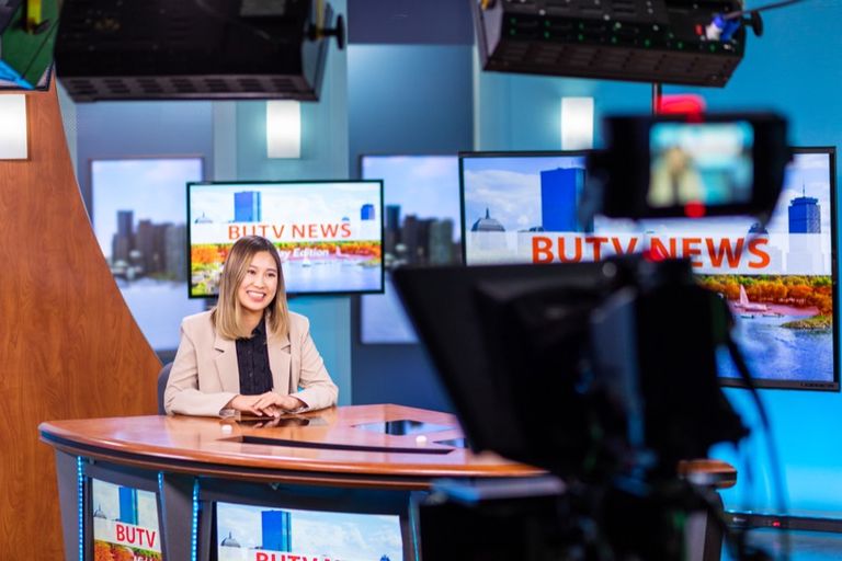 Student broadcasting from the news studio.
