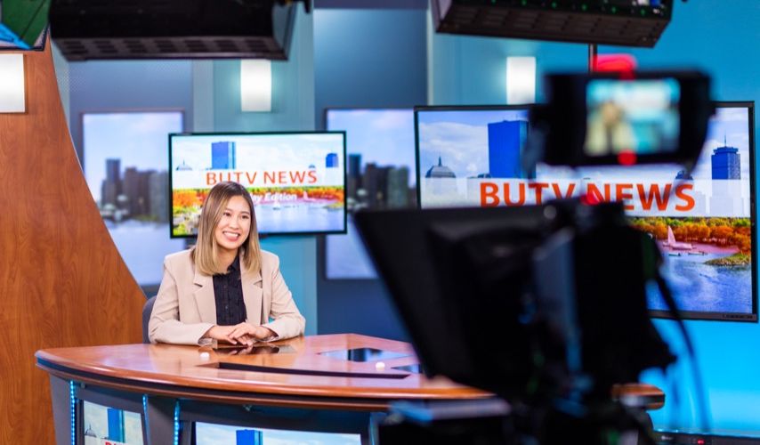 Student broadcasting from the news studio.