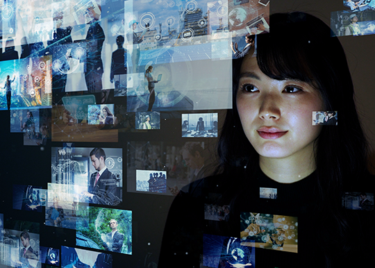 Woman looking at a series of floating screens.