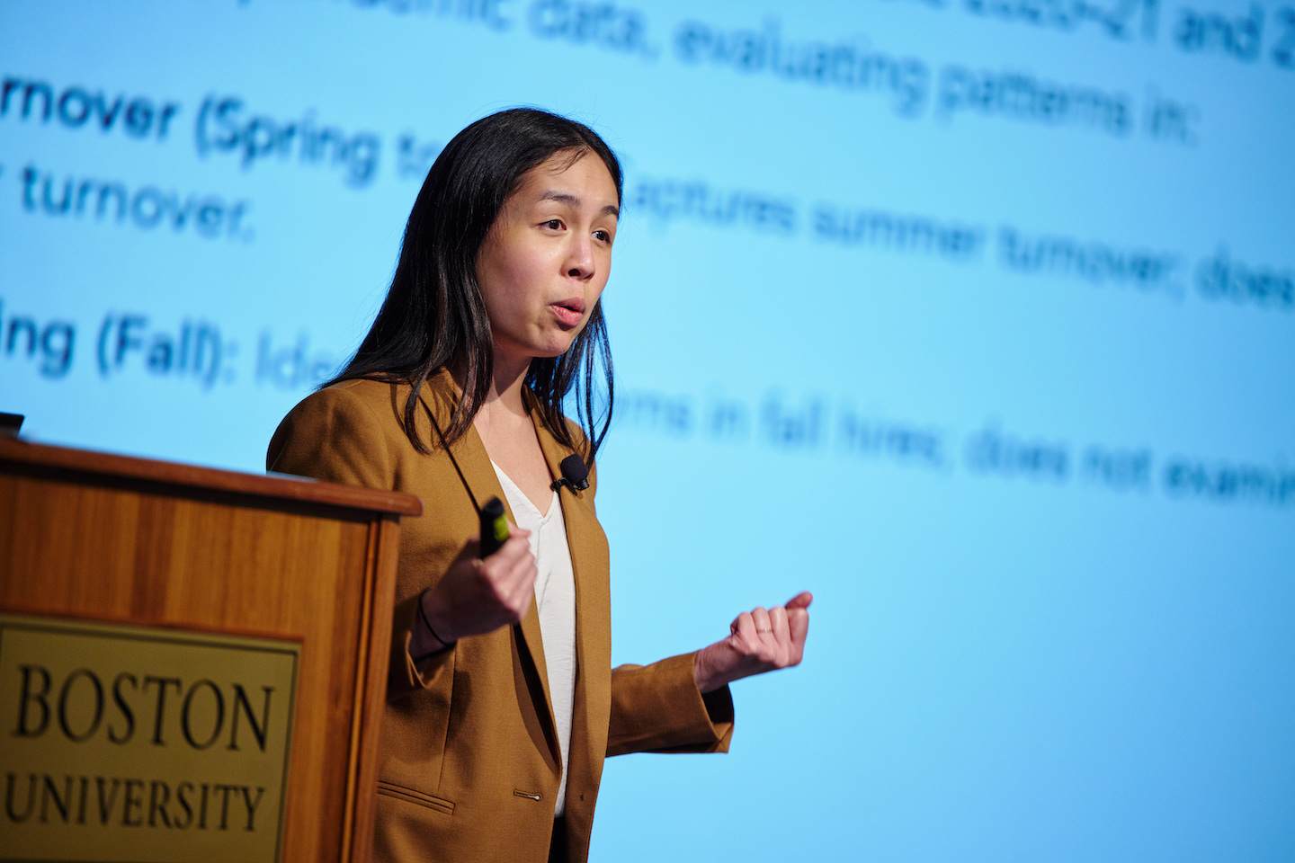 Olivia Chi presenting research findings at the 2022 BU Wheelock Forum